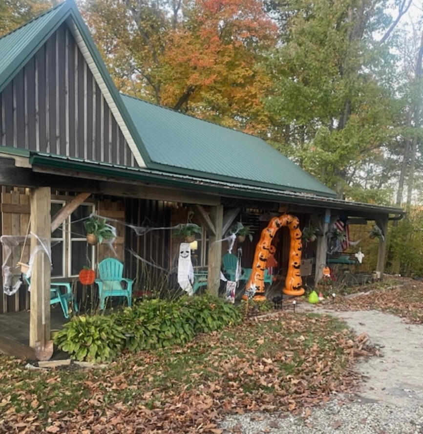 This cabin was built solely by DLR, including a interior loft, and exterior overhanging back deck, and additions with real live wood as support beams!