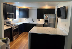 Kitchen cabinets, kitchen appliances, custom kitchen countertops, tv mount, upper and lower cabinetry lighting, crown-moulding.