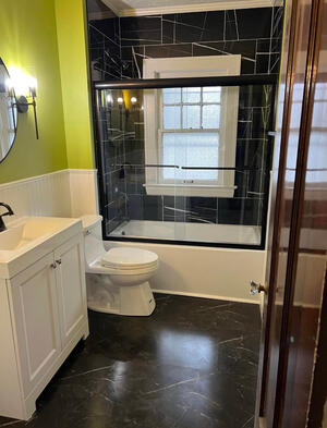 Matching tile~ floor and shower, vanity, custom bead-board style walls, unique appliances